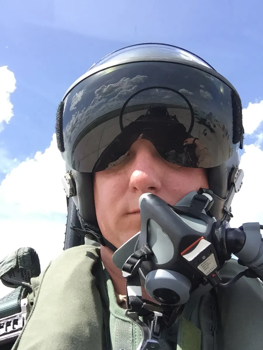 Matt Samson, Marine Corps F/A-18 pilot and ILS Financial founder, in the cockpit in full flight gear