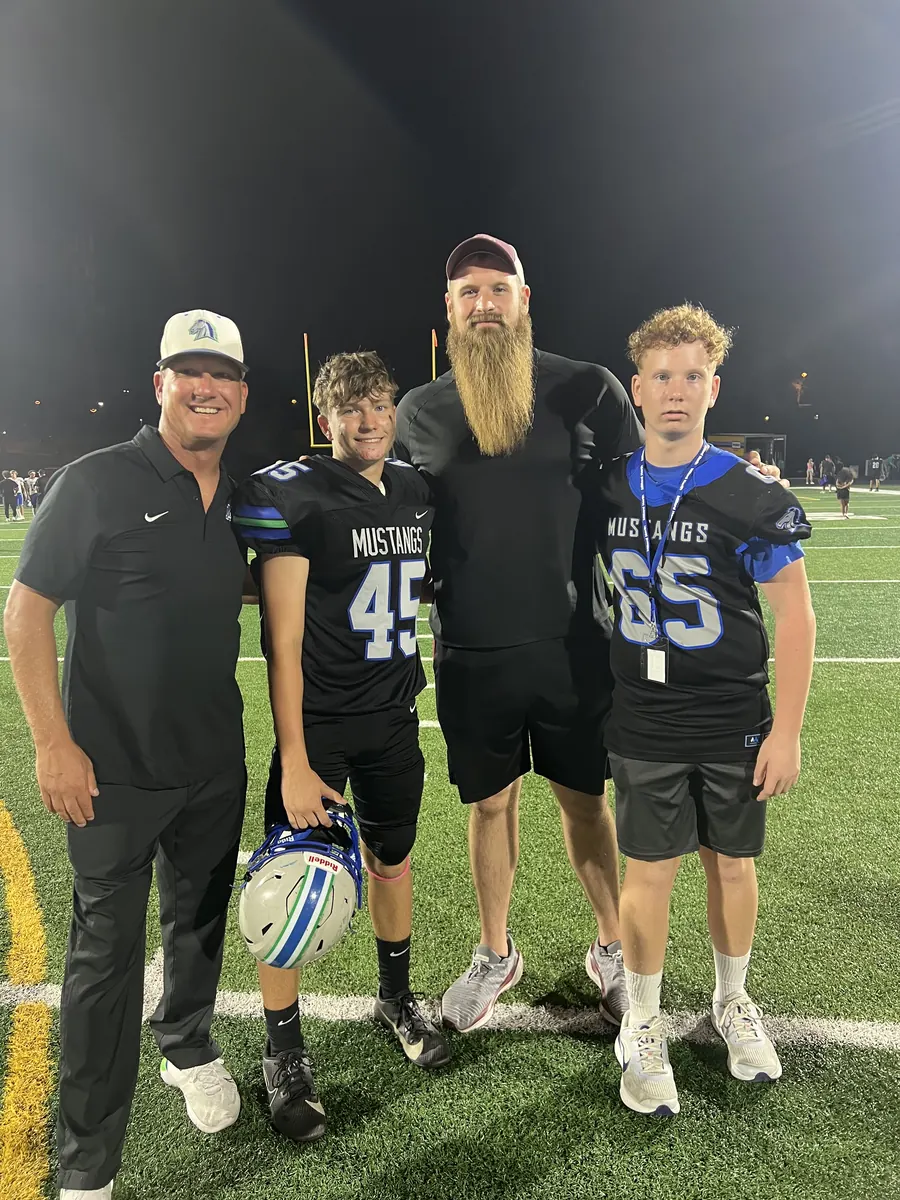 Matt Samson coaching varsity football on the sideline